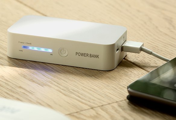 Power Bank Gift charging an iPad.